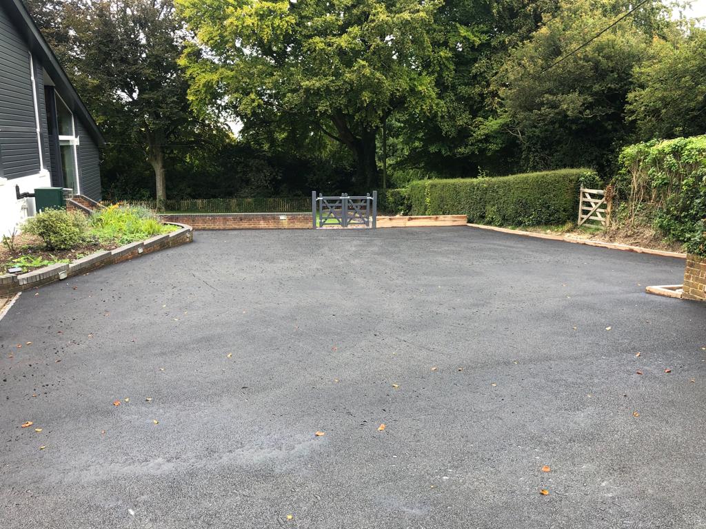 This is a photo of a bitumen driveway which is in the process of being installed by Blayney Road Tek